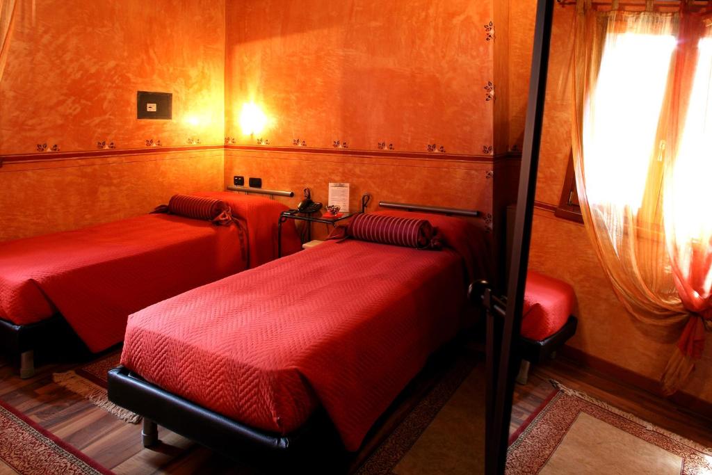 Postel nebo postele na pokoji v ubytování Hotel Tabina