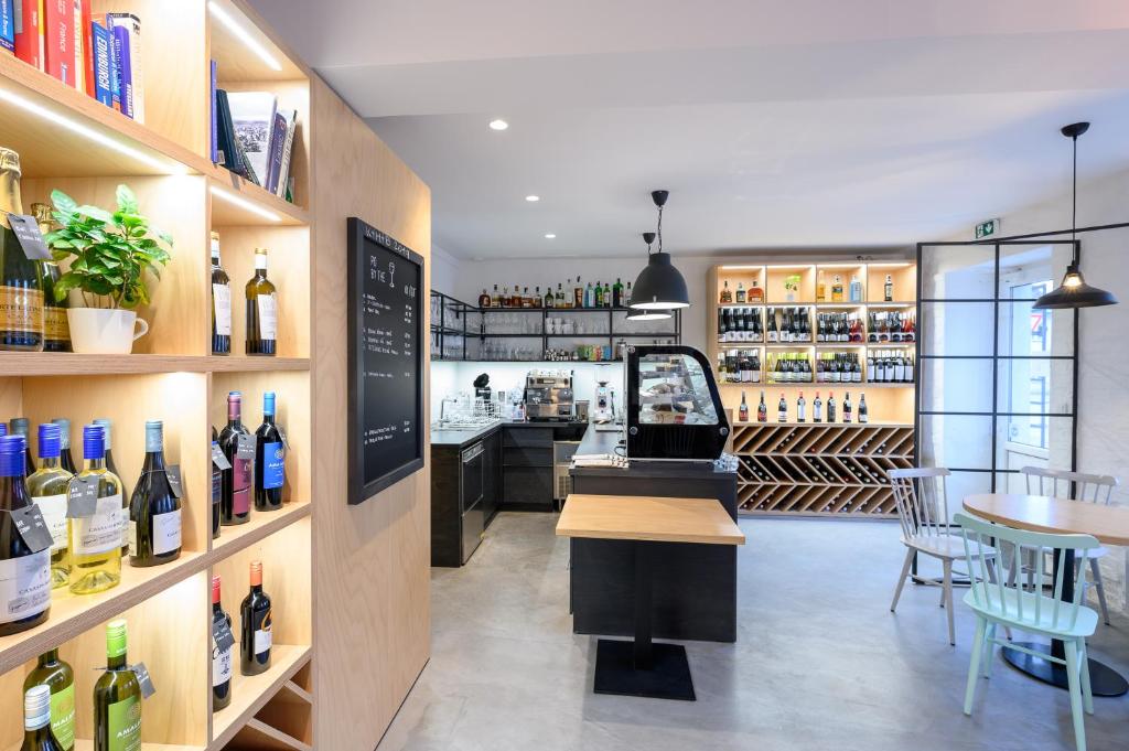 a wine tasting room with a bar and wine bottles at Světoběžník Bed & Wine in Liberec