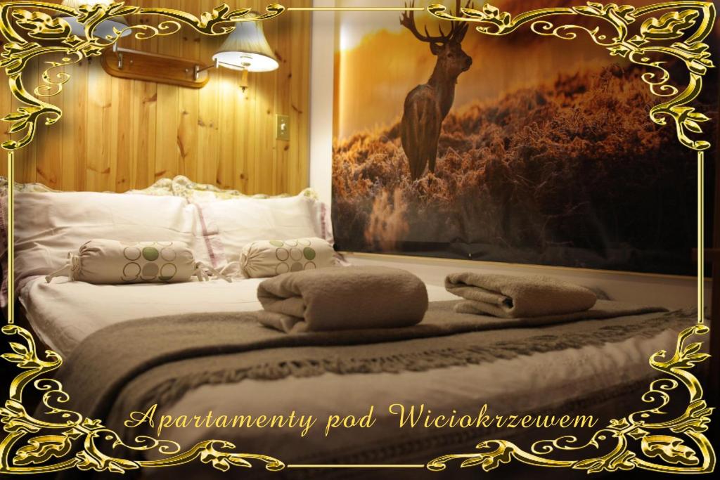 Postel nebo postele na pokoji v ubytování Apartamenty pod Wiciokrzewem