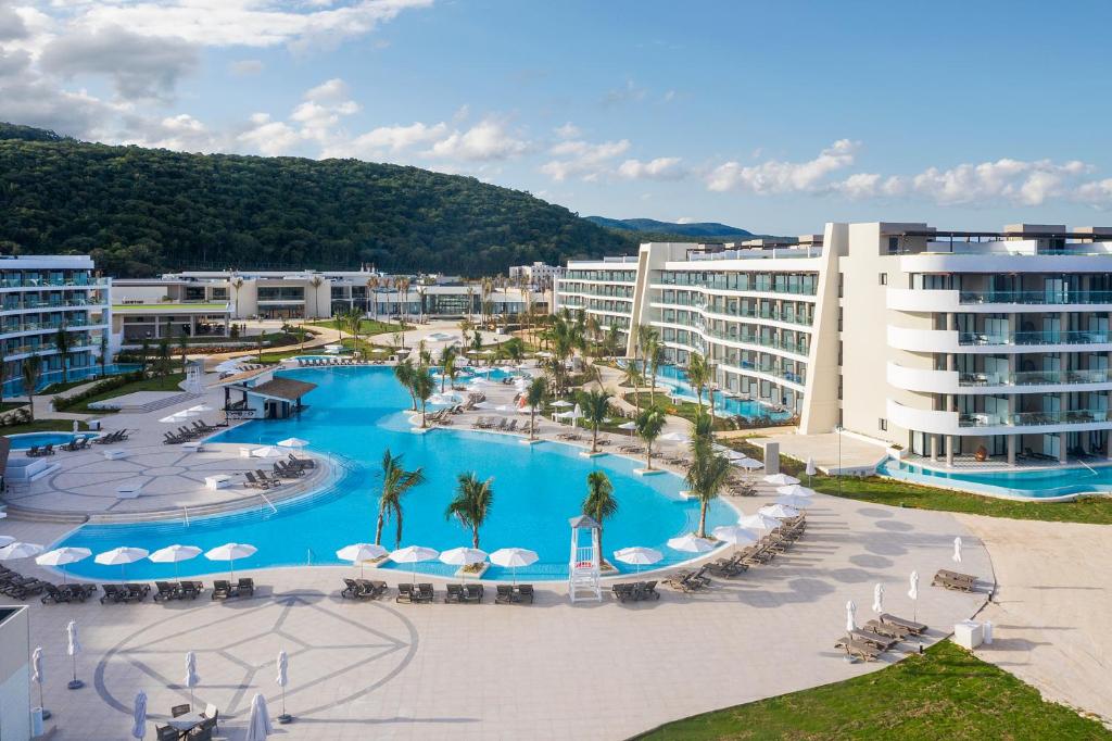 an aerial view of a resort with a pool at Ocean Coral Spring Resort - All Inclusive in Spring Rises