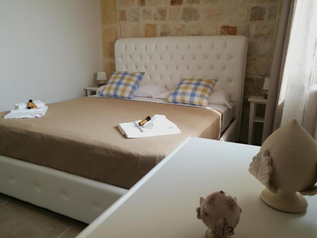 Postel nebo postele na pokoji v ubytování Hotel Residence La Corvetta