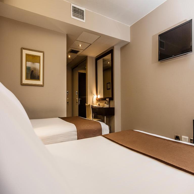 Postel nebo postele na pokoji v ubytování Del Pilar Miraflores Hotel