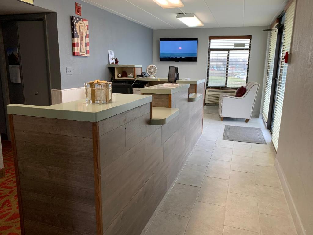 an office lobby with a counter and a waiting room at Days Inn by Wyndham Winchester in Winchester