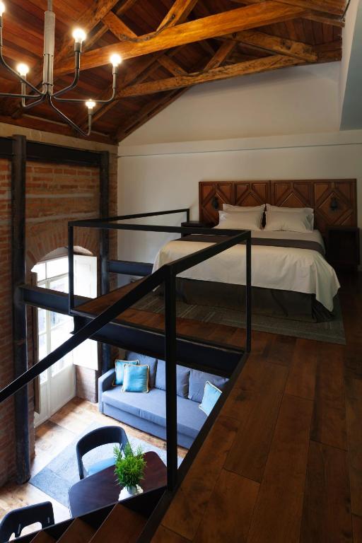 Postel nebo postele na pokoji v ubytování Carlota Sustainable Design Hotel