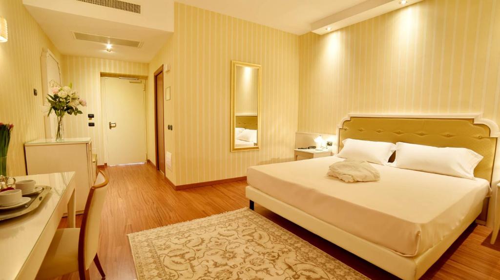 Postel nebo postele na pokoji v ubytování Sweet Motel