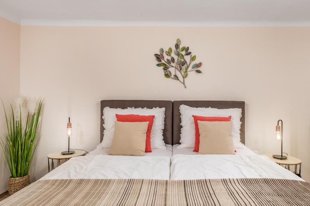 Łóżko lub łóżka w pokoju w obiekcie Apartment Carolina