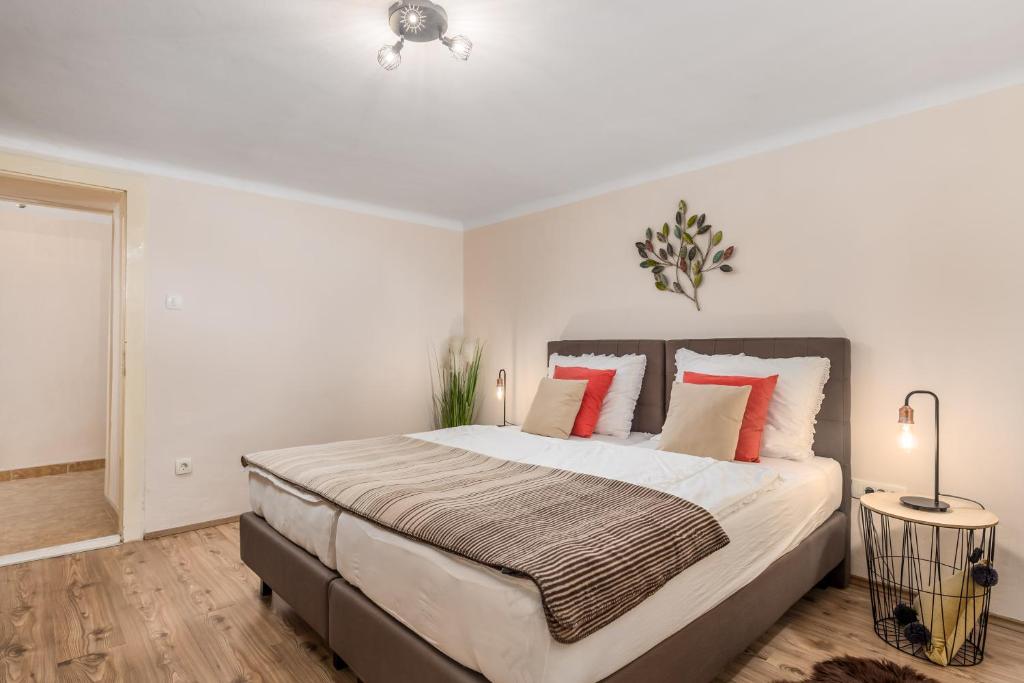 Łóżko lub łóżka w pokoju w obiekcie Apartment Carolina