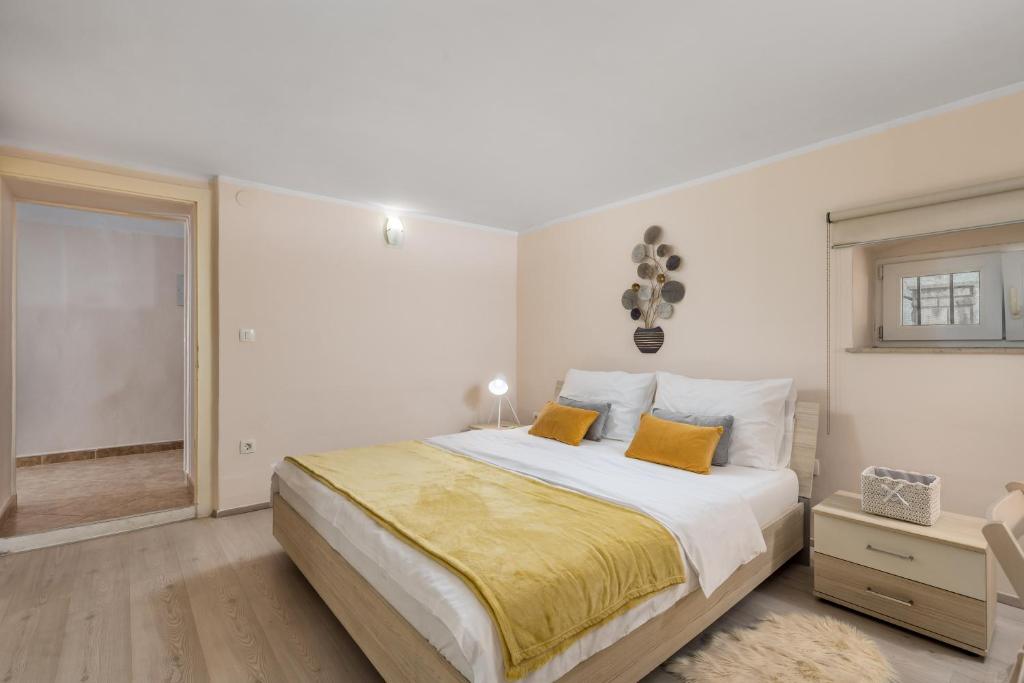 Łóżko lub łóżka w pokoju w obiekcie Apartment Carolina