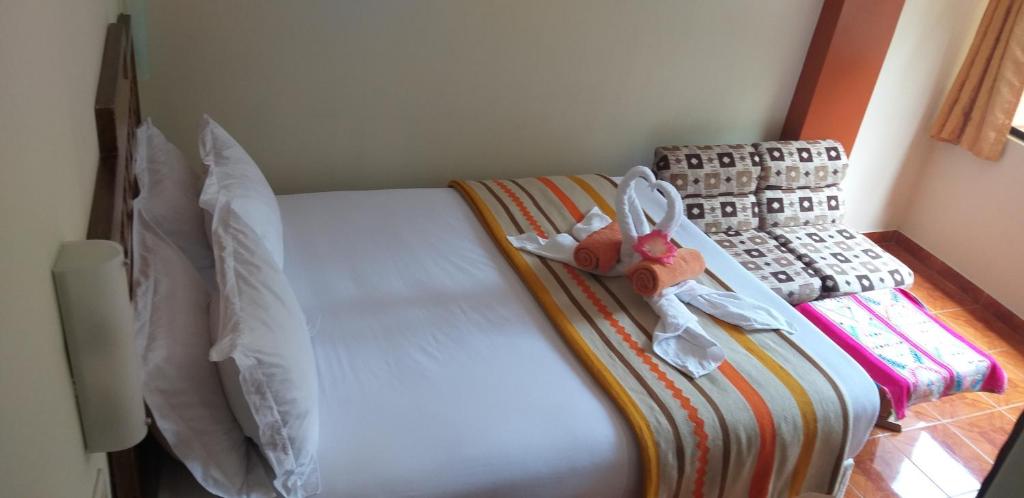 Cama o camas de una habitación en Hostal Vista Waynapata 123