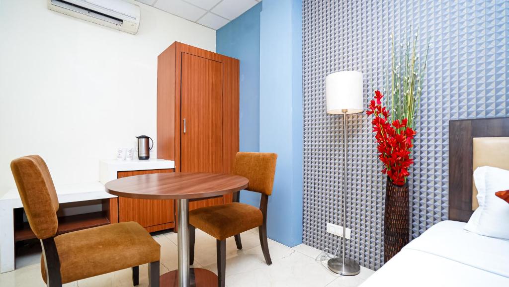 Postel nebo postele na pokoji v ubytování Hotel Pooja Palace