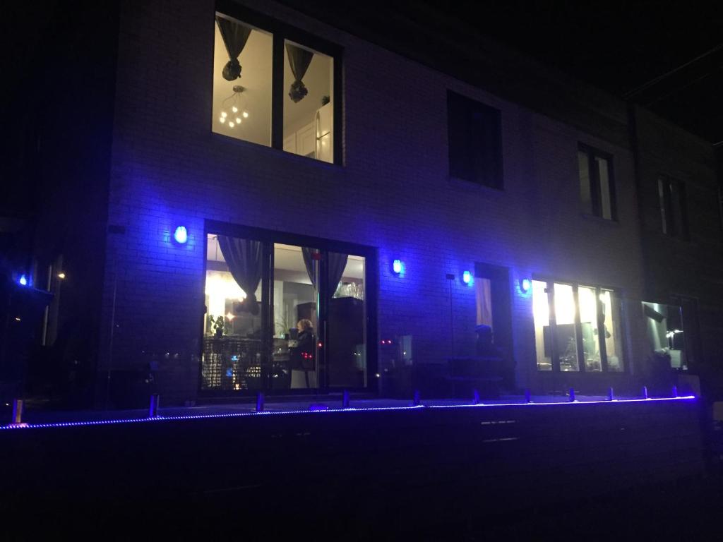 a building with blue lights in front of it at night at Gîte Zazen in Mont-Laurier