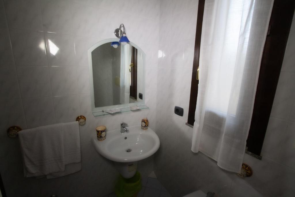 Koupelna v ubytování Hotel Merlino