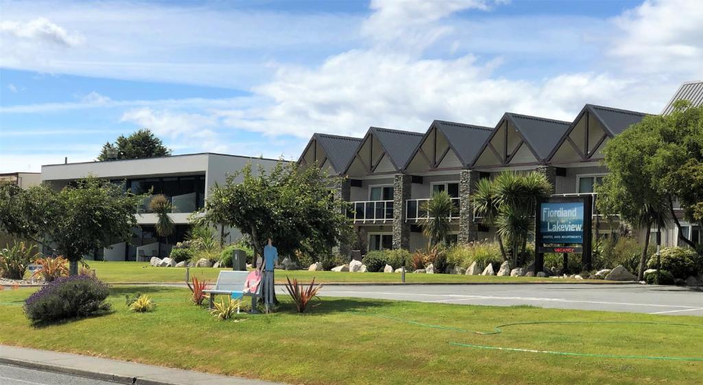 a large building on the side of a road at Fiordland Lakeview Motel and Apartments in Te Anau