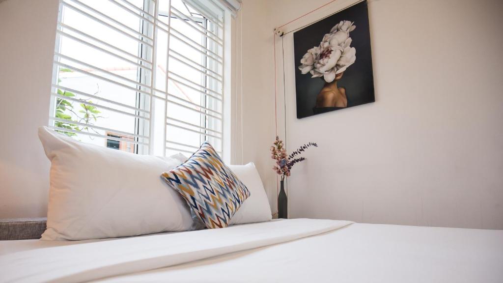 Postel nebo postele na pokoji v ubytování Nem's House Hội An