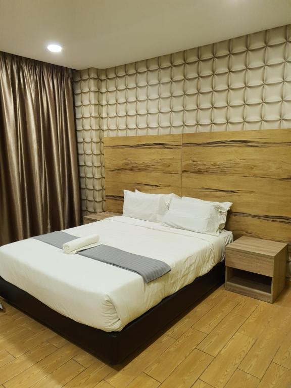 Postel nebo postele na pokoji v ubytování Bangi Perdana Hotel