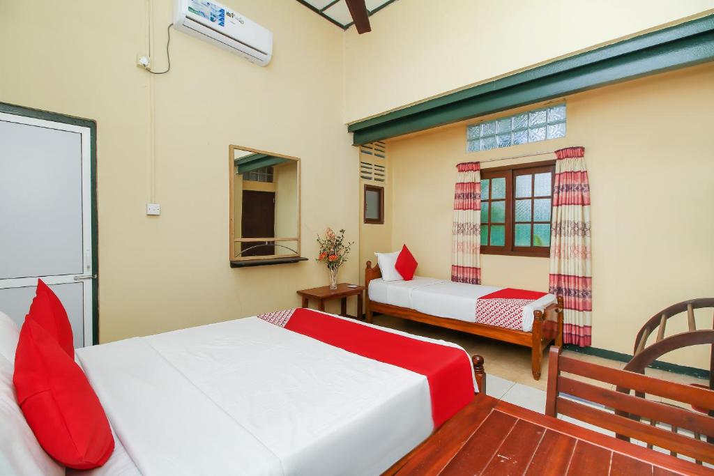 Postel nebo postele na pokoji v ubytování Leo's Home Stay