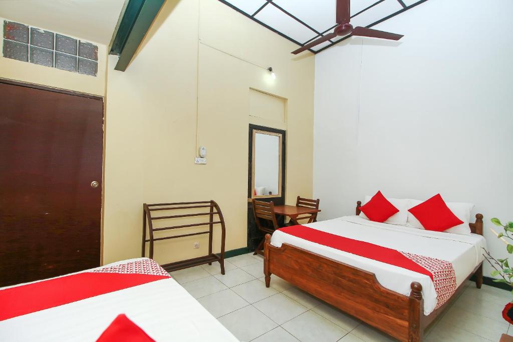 Postel nebo postele na pokoji v ubytování Leo's Home Stay
