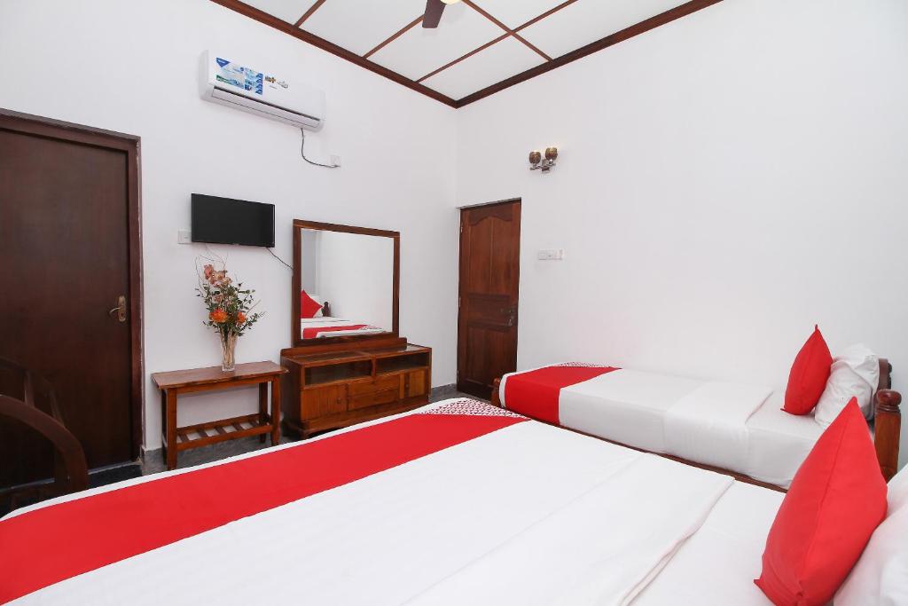 Postel nebo postele na pokoji v ubytování Leo's Home Stay