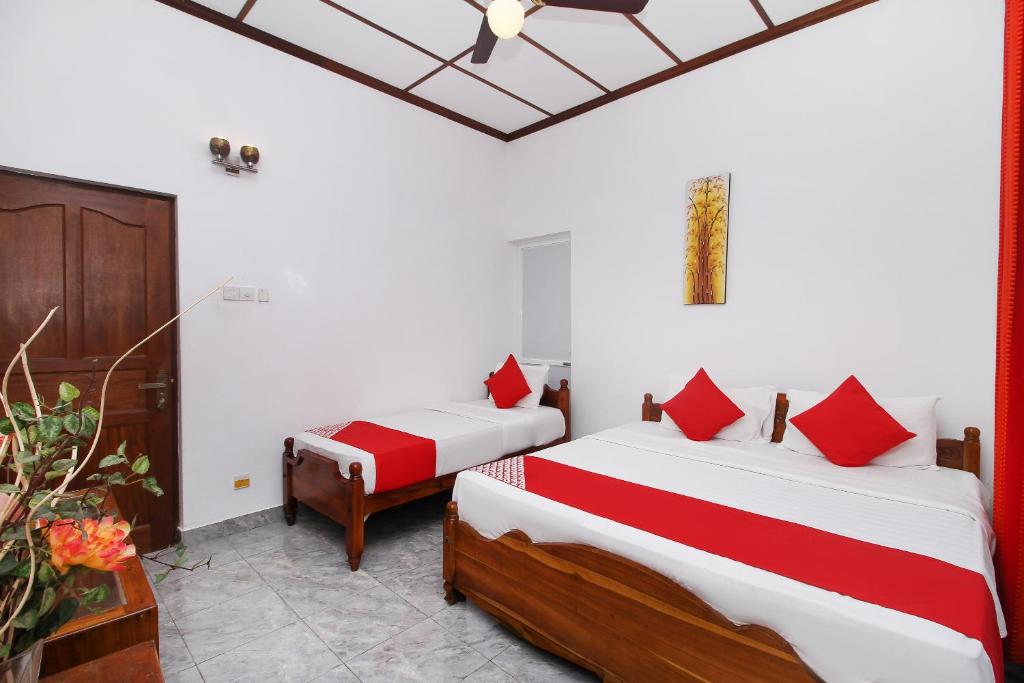 Postel nebo postele na pokoji v ubytování Leo's Home Stay