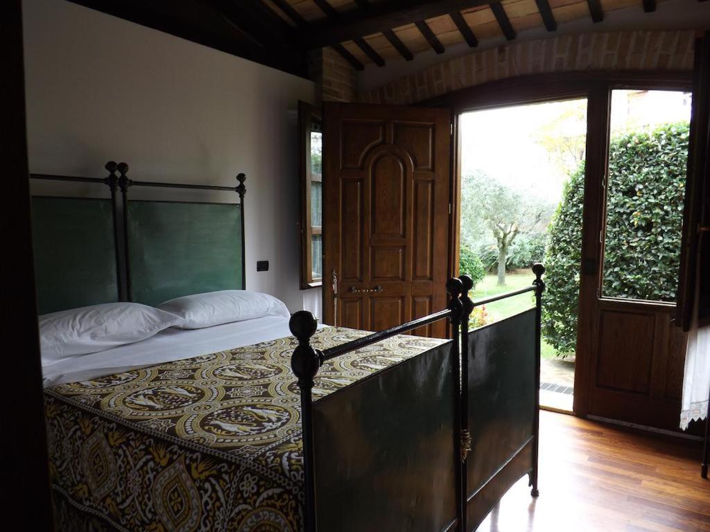 Кровать или кровати в номере Agriturismo San GIovanni Ad Insulam
