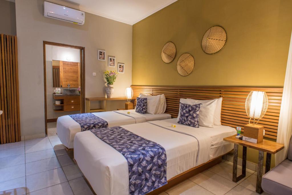 Postel nebo postele na pokoji v ubytování Pangkung Sari Bed and Breakfast