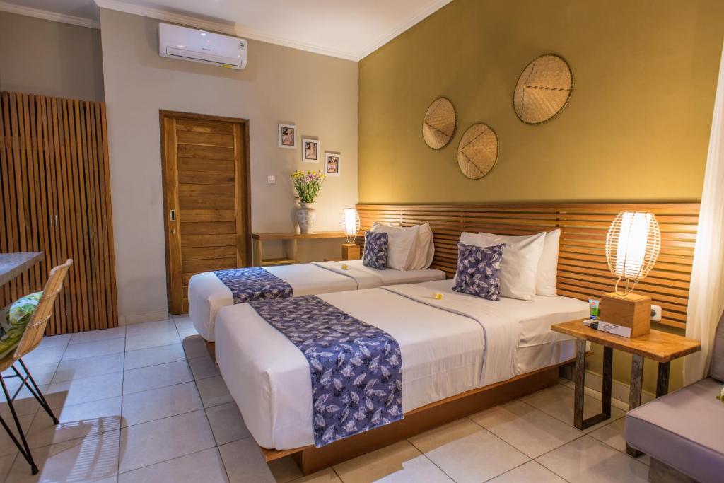 Postel nebo postele na pokoji v ubytování Pangkung Sari Bed and Breakfast