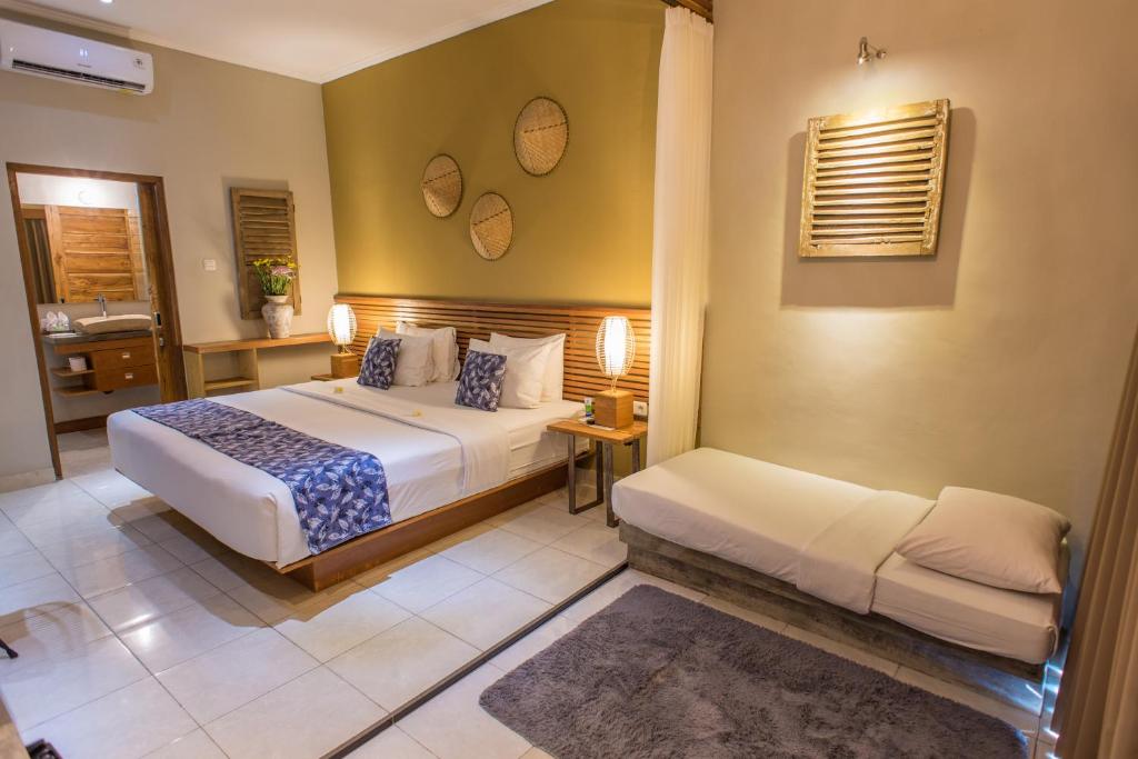 Postel nebo postele na pokoji v ubytování Pangkung Sari Bed and Breakfast