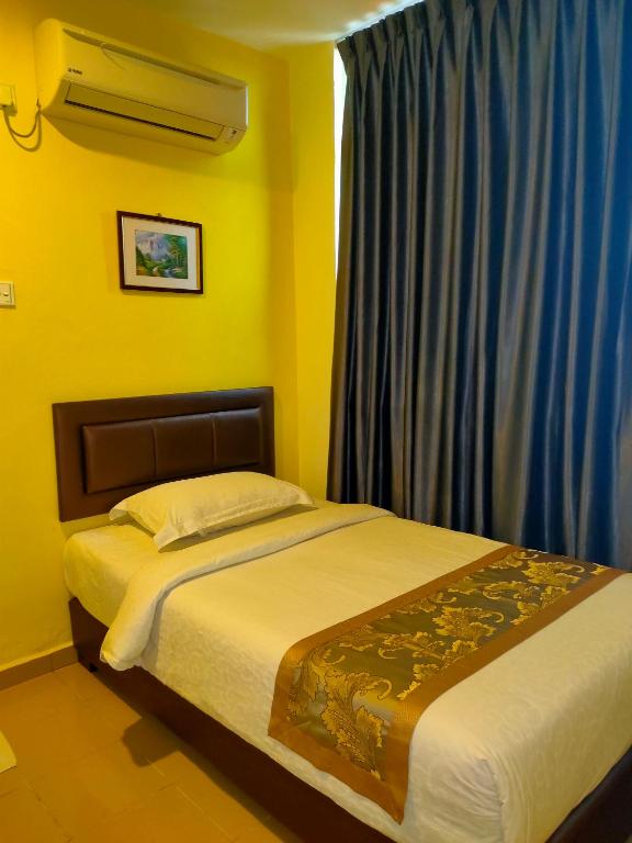 Postel nebo postele na pokoji v ubytování TIONG HUA HOTEL
