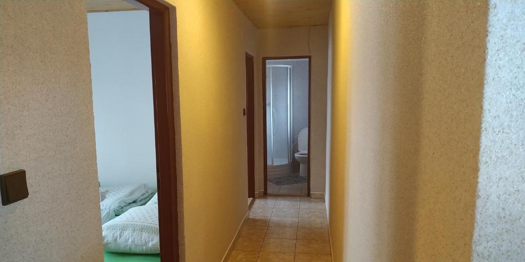 Postel nebo postele na pokoji v ubytování Dovolenkový dom Zuberec