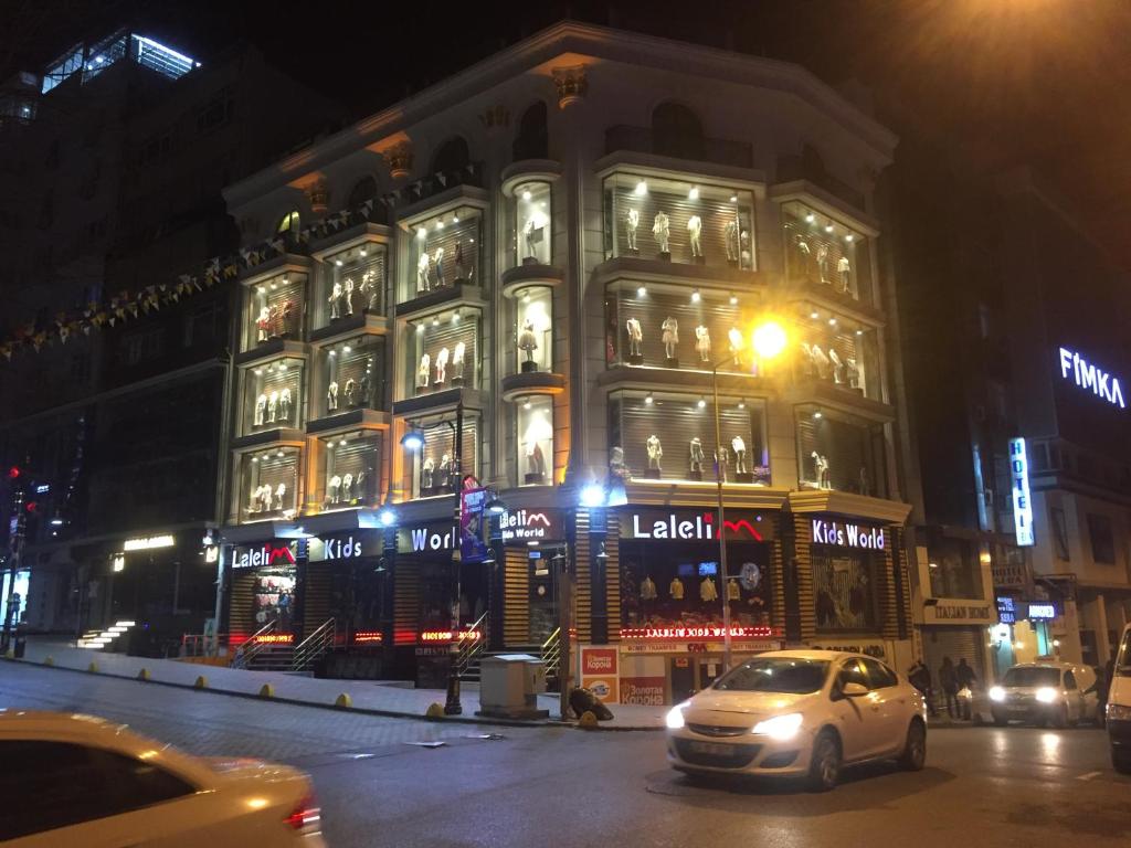 a car parked in front of a building at night at Florin Hotel in Istanbul