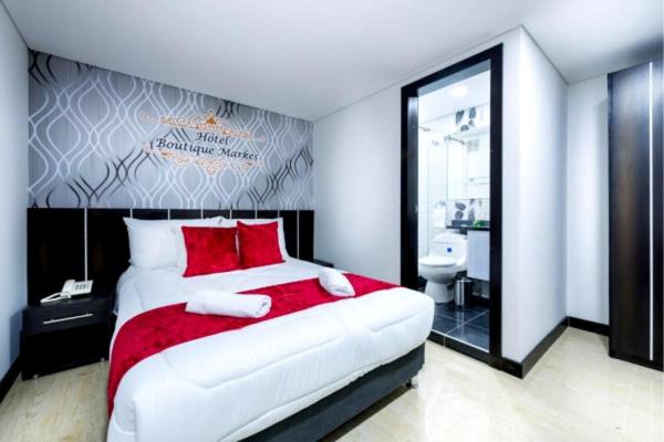 Postel nebo postele na pokoji v ubytování Hotel Boutique Markes
