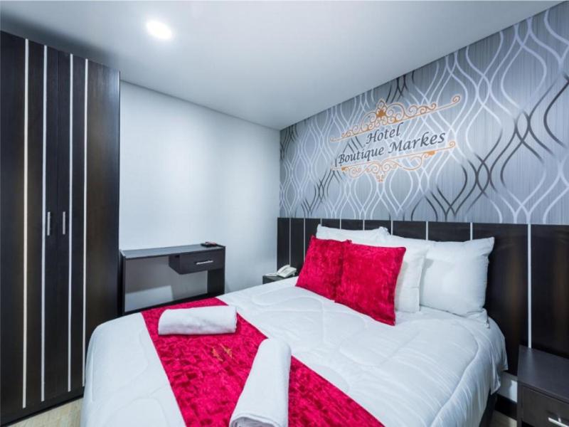 Postel nebo postele na pokoji v ubytování Hotel Boutique Markes