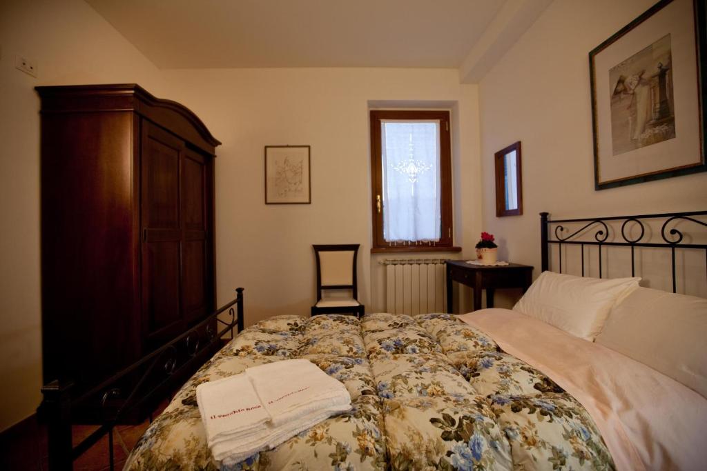 Postel nebo postele na pokoji v ubytování Il Vecchio Noce