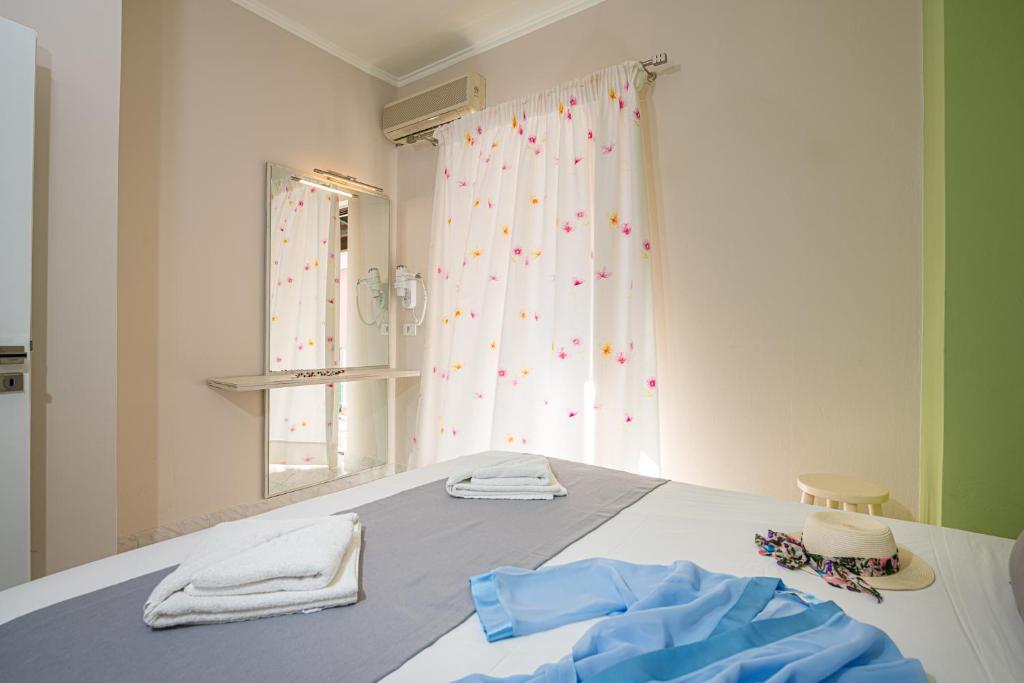 Postel nebo postele na pokoji v ubytování Maria Studios