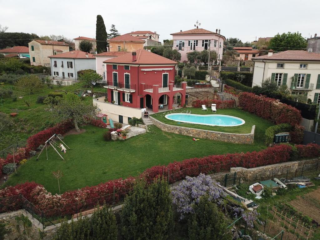 a house with a large yard with a swimming pool at Casa Il Sogno in Montemarcello