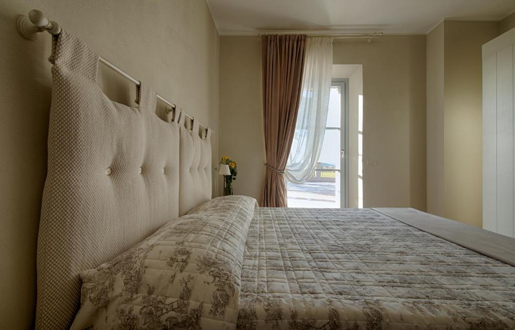 Postel nebo postele na pokoji v ubytování Agriturismo Poderedodici