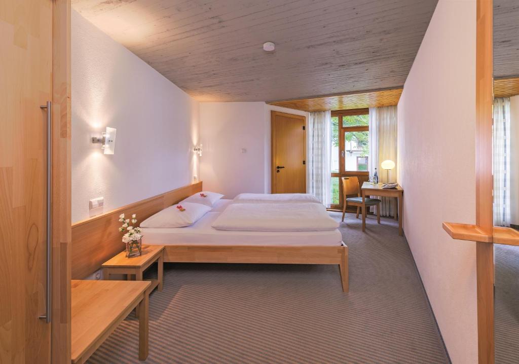 a bedroom with a large bed in a room at Hohenwart Forum in Pforzheim