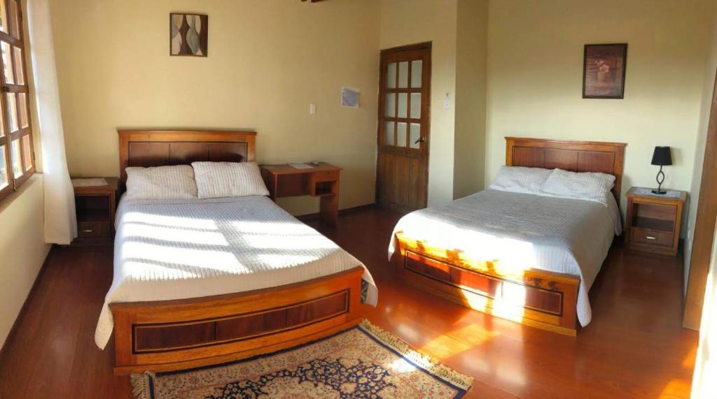 Postel nebo postele na pokoji v ubytování Hosteria San Carlos Tababela
