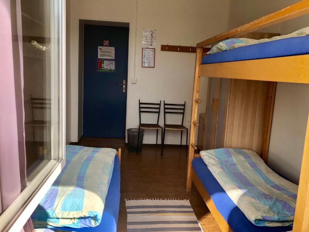 Letto o letti in una camera di Auberge Pour Tous