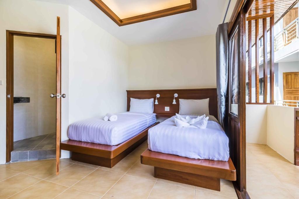 Postel nebo postele na pokoji v ubytování Wyh Hotels