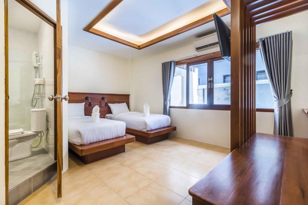Postel nebo postele na pokoji v ubytování Wyh Hotels