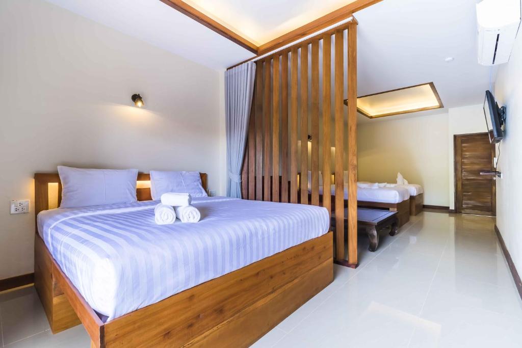 Postel nebo postele na pokoji v ubytování Wyh Hotels