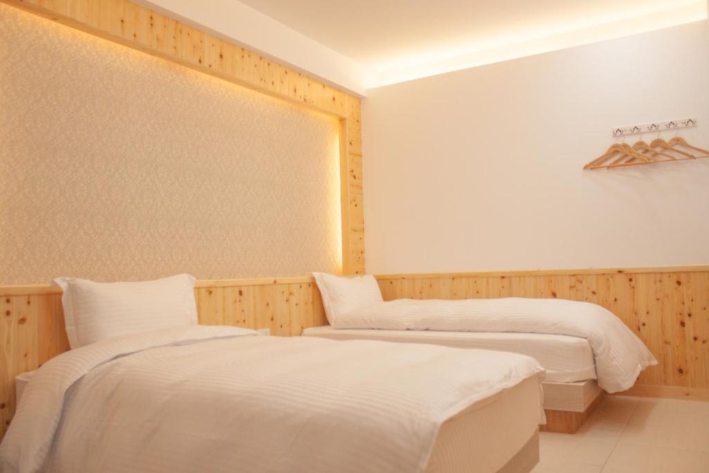 Postel nebo postele na pokoji v ubytování Yellow Mountain Homestay