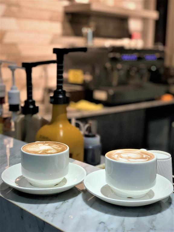 Příslušenství pro přípravu čaje a kávy v ubytování Capitol Hill Hotel and Suites