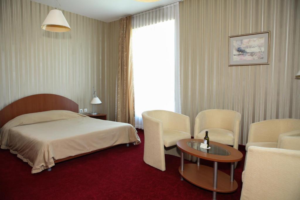 Postel nebo postele na pokoji v ubytování Hotel Perperikon