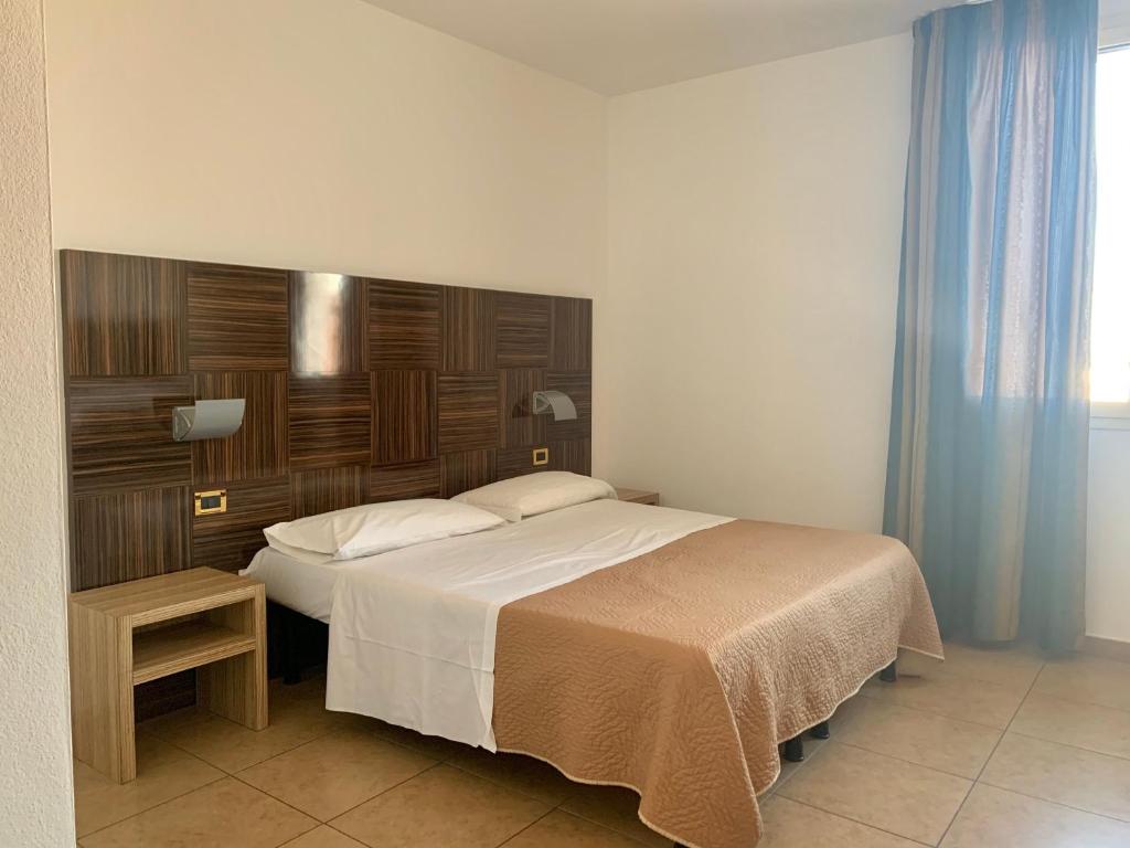 Postel nebo postele na pokoji v ubytování Hotel Riverside