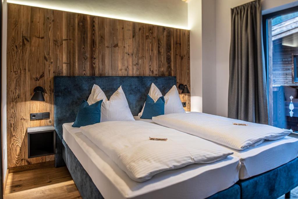 Posteľ alebo postele v izbe v ubytovaní Chalet's DAS DORF