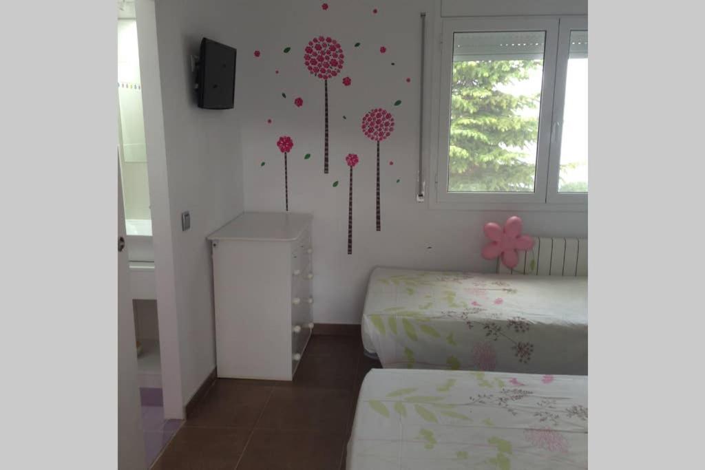 Postel nebo postele na pokoji v ubytování Villa olivella