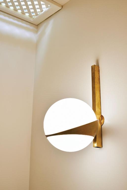 a light fixture hanging on a wall in a room at Splendido Mare, A Belmond Hotel, Portofino in Portofino