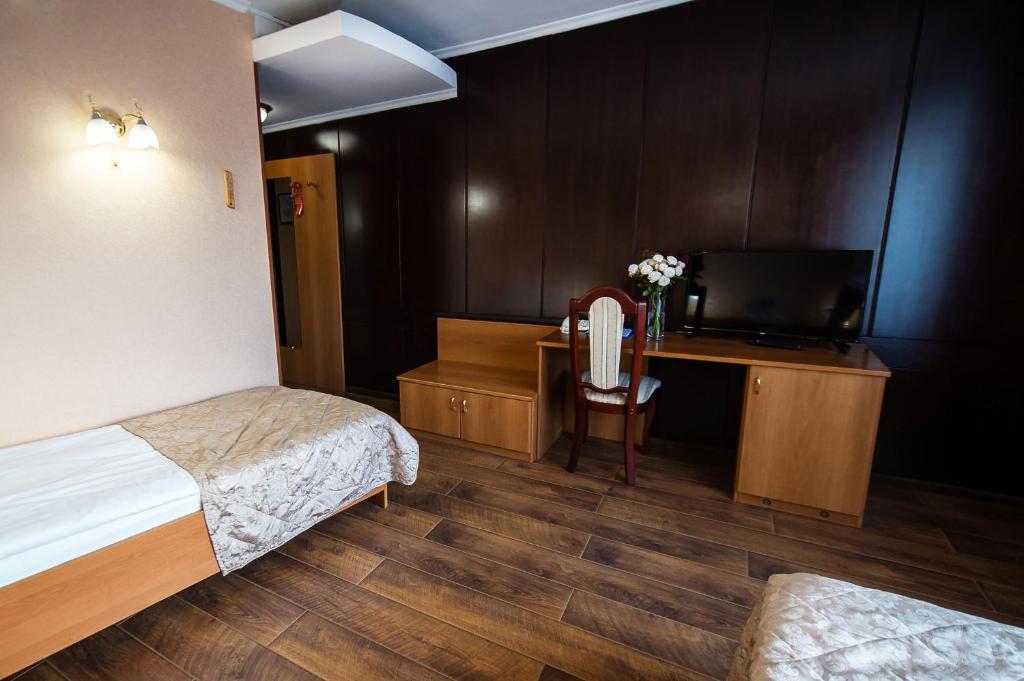 Postel nebo postele na pokoji v ubytování Salute Hotel